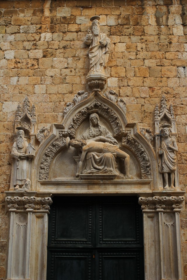 One of many carved entrance ways and statues inside the walls